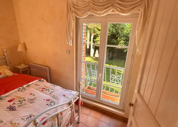 Апартаменти Aux Jardins Fleuris